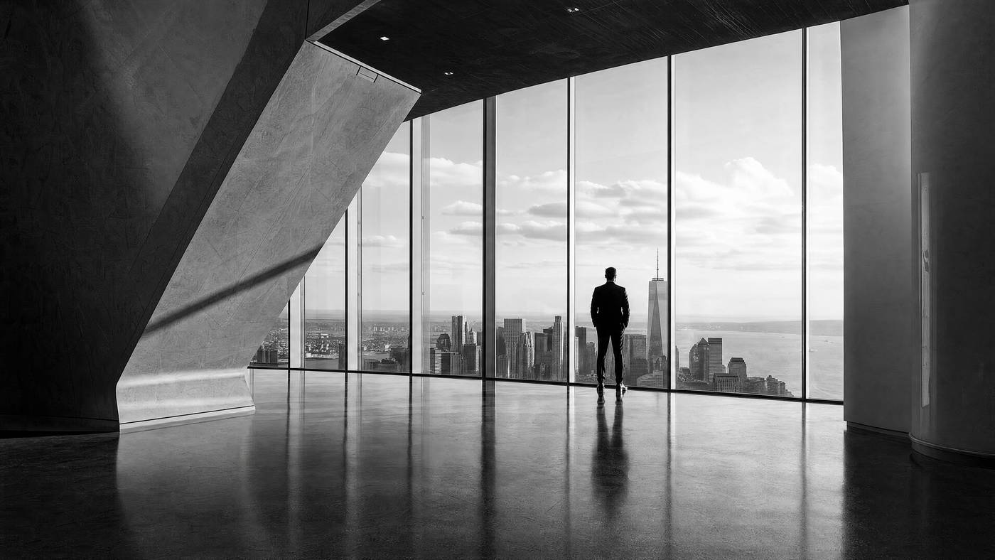 Executive looking out over a city skyline — EXG mission for energy, maritime and trade infrastructure